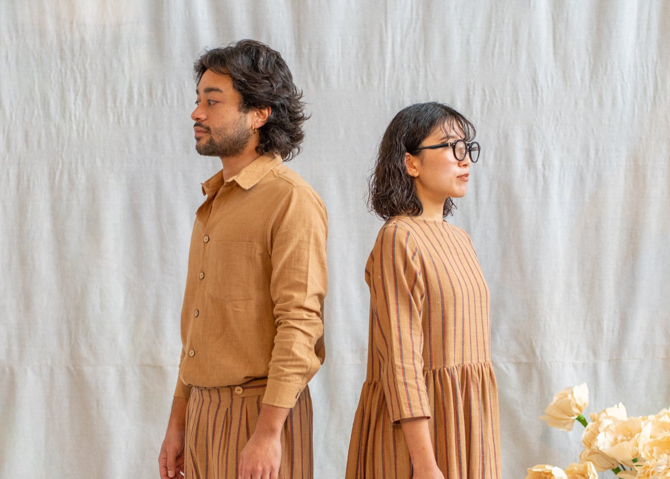 Man and woman in matching brown pieces made from Kala Cotton. The Anjelms Project, Fremantle based fashion brand that focuses in Fairtrade and ethical practices.